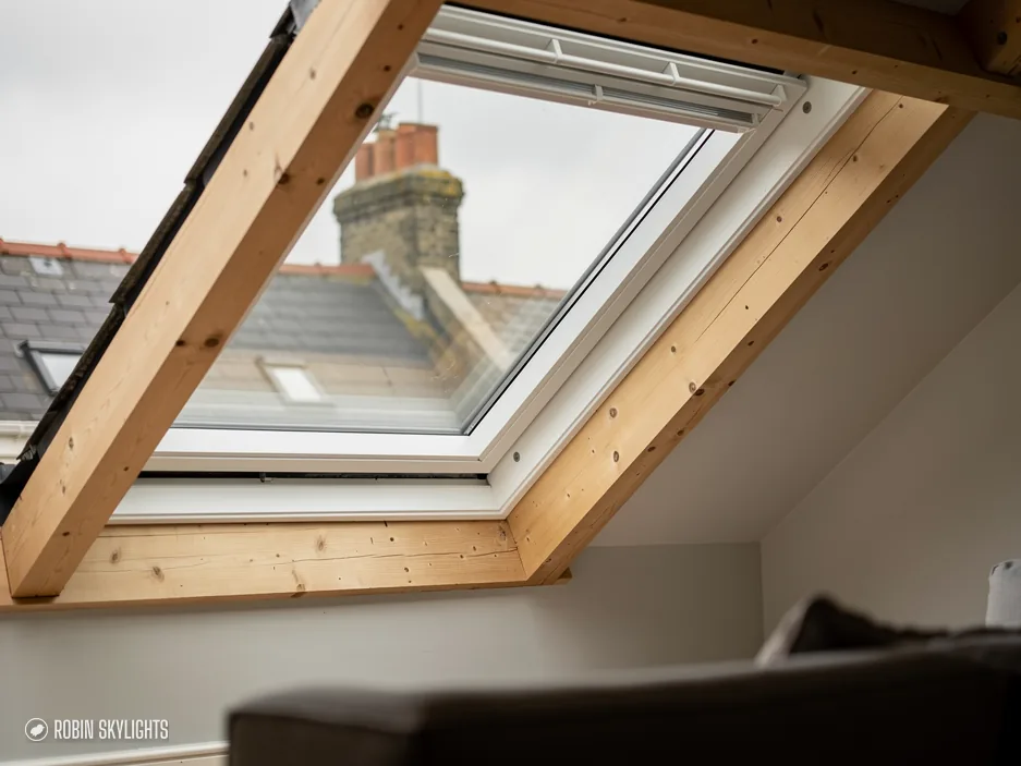 Pine roof window from inside looking out to neighbouring roofs