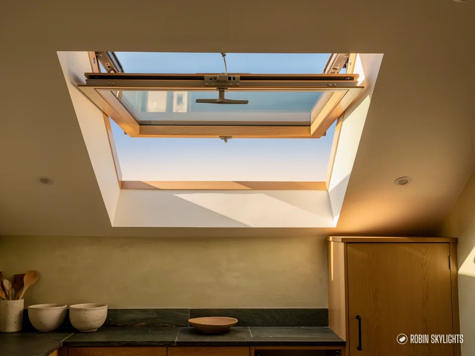 Open roof window above a kitchen worktop with bowls